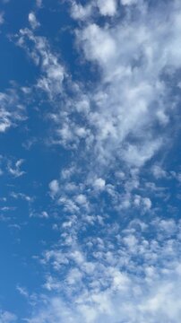 Beautiful blue sky with clouds vertical video.