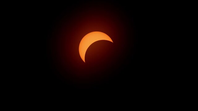 Beautiful drone and ground footage of the partial solar eclipse over Halifax, Nova Scotia. Glowing crescent sun on April 8, 2024, rare astronomical event in Canada 4K.