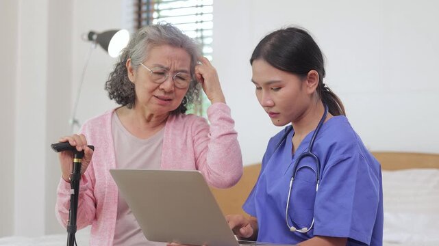 Professional female nurse or doctor consulting a senior woman with memory loss or headache, showing empathetic healthcare service and support for elderly patient at home.