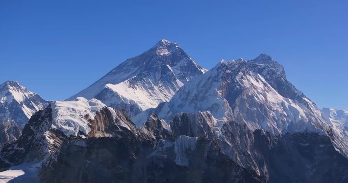 Gokyo Ri, Khumbu Region, Everest Nepal, static view featuring the majestic snow-capped peak of Mount Everest contrasting against a clear blue high-altitude sky