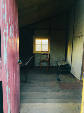 Manzanar internment camp barracks interior showing window and door