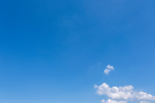 Clear Blue Sky with Soft White Clouds and Bright Natural Daylight Background, Beautiful Clear Blue Sky with Soft White Clouds and Ample Copy Space
Clear blue sky with soft white clouds on a bright sun