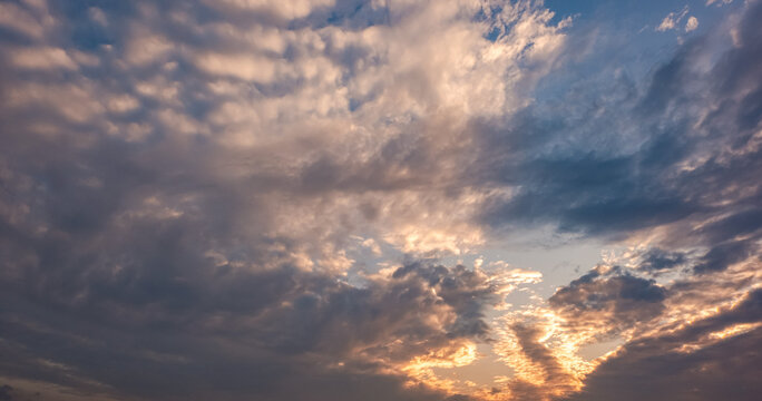Panoramic view of sunset golden and blue sky nature background.
Colorful dramatic sky with cloud at sunset.Sky background.Sky with clouds at sunset.