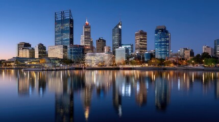 Obraz premium City skyline during twilight with modern buildings and reflections in calm water at night in a vibrant urban landscape