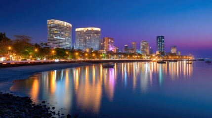 Fototapeta premium Stunning Cityscape Reflection at Dusk with Vibrant Lights and Calm Waters along Urban Waterfront