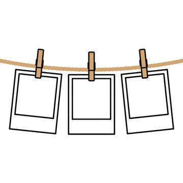 Three blank instant photo frames hanging on a clothesline