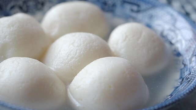 ball-shaped items are Rasgulla, a popular Bengali sweet dessert