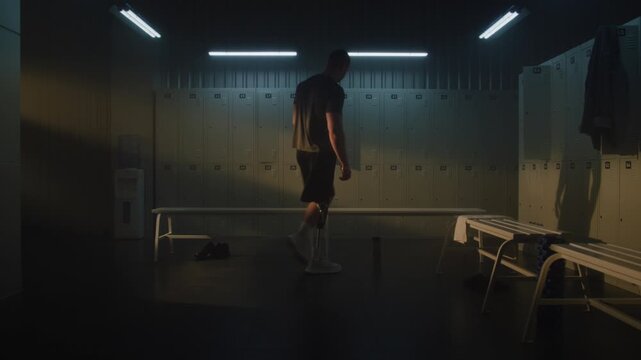 Man With Leg Prosthesis Enters Locker Room, Sits Alone on Bench, Stretching Neck and Breathing Deeply, Finding Moment of Calm, Reflection After Training. Post Workout Recovery, Mindfulness. Portrait.