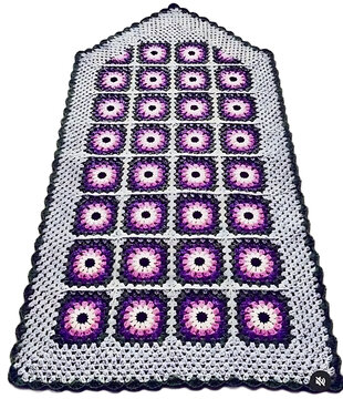 Colorful bingo card with numbers and daubers on game sheet