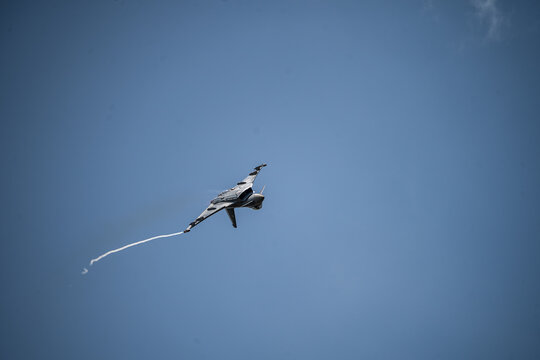Berlin, Germany - 13 June 2026: View of Eurofighter Typhoon performing an aerial maneuver at the ILA Berlin Air Show against a clear blue sky.