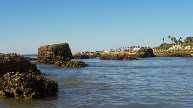 Ocean rocks at Playa Micaela near Chipiona, Cadiz, Spain