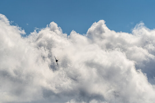 Berlin, Germany - 13 June 2026: View of a Eurofighter Typhoon performing an aerial maneuver against a backdrop of dramatic clouds at the ILA Berlin Air Show.