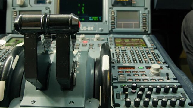 Close up view of Airbus A330 cockpit thrust levers and center pedestal inside the flight deck.