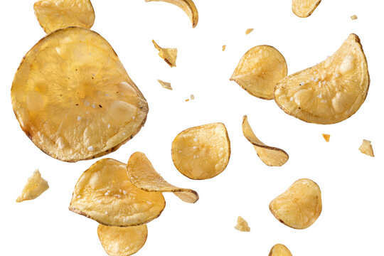 Thin crispy golden potato chips floating and falling in mid air on a plain solid , studio action food shot
