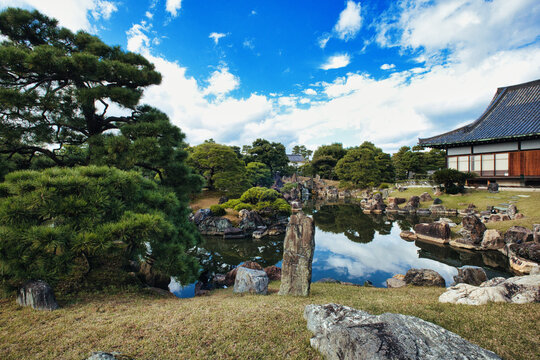 Kyoto, Japan - 11 November 2025: View of Rinn Kyoto Imperial Palace South Kishoan featuring a traditional Japanese garden with a tranquil pond, manicured pine trees, and decorative rocks.