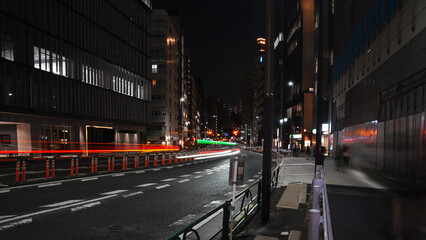 Colorful Red and Green Car Light Trails on Japanese City Street at Night © takayuki
