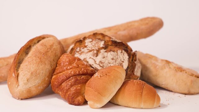 Hand Picking Sliced Multigrain Bread from Assorted Bakery Products