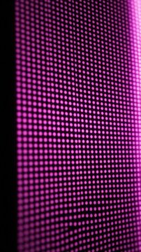 Abstract pink led screen with glowing digital dot pattern
