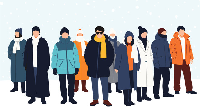 Large group of diverse men and women standing together in warm winter coats and hats while snow falls around them.