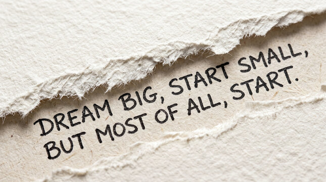 Torn white textured paper with black motivational typography dream big. Inspirational design for posters, websites, social media, and presentations.