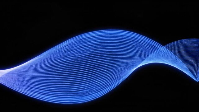 Abstract glowing wavy ribbon composed of numerous parallel purple and blue lines flowing across a black background, representing digital data, energy, or light trails in motion.