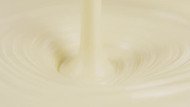 Close-Up of Creamy Milk Pouring with Soft Ripples