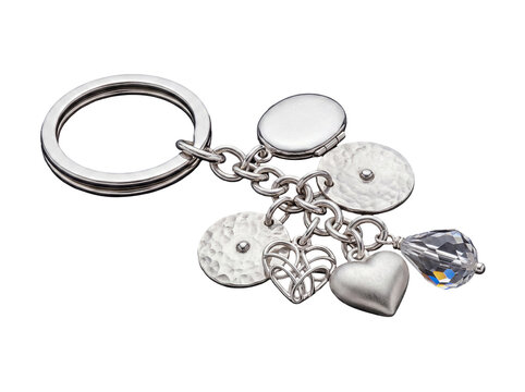 Sophisticated silver keychain adorned with diverse charms, including a locket, hammered discs, Celtic heart.