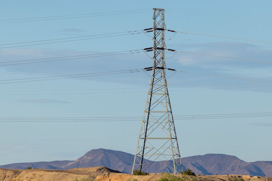 High voltage power lines over desert mountains