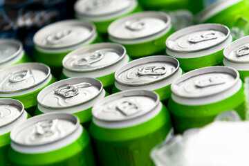 Naklejka premium High angle view of unbranded green aluminum cans chilling in ice
