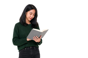 Fototapeta premium Asian female student standing and writing notes in her book after class