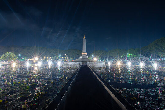 Beautiful night view of Alun-Alun Tugu monument and lotus pond public park in Malang, East Java, Indonesia