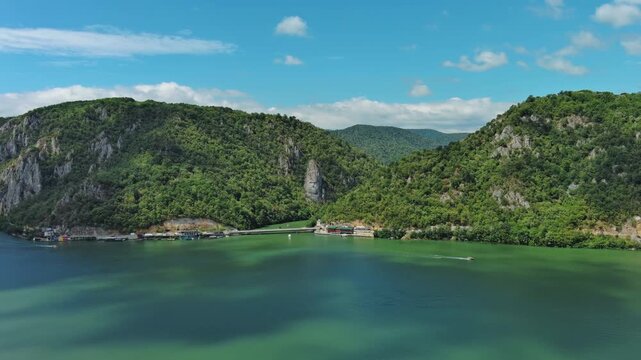 Aerial view of stone carved statue portrait of ancient dacian king Decebal. Sculpture located on shore of Danube River, Romania, 4k