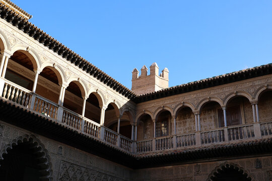 Arched arcade in the courtyard of the Alc&aacute;zar of Seville, Andalusia, Spain