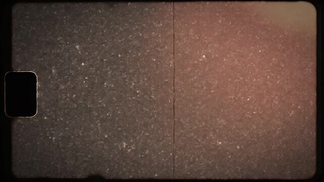 A vintage film negative displays a textured, grainy surface with a characteristic sprocket hole, evoking a sense of aged photography and historical documentation.