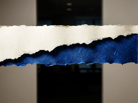 Torn paper strips with rough edges in white and deep blue texture