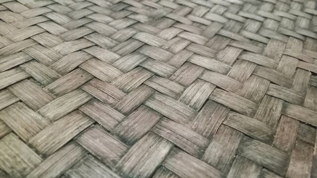 Traditional woven bamboo texture background, rustic grey weathered braided wooden pattern close up