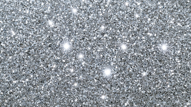 Silver glitter texture with sparkling metallic shine and shimmering surface. Festive background for luxury design, holiday card, party invitation, wallpaper and decorative template.