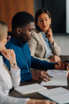 Diverse business team collaborating during office meeting