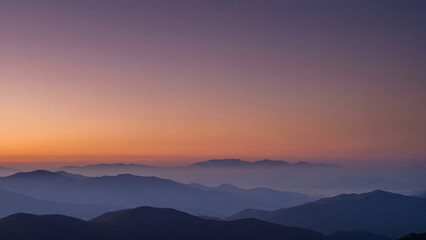 Obraz premium Mountain range sunset silhouette layers golden hour purple orange sky peaceful majestic landscape for poster design background wallpaper banner