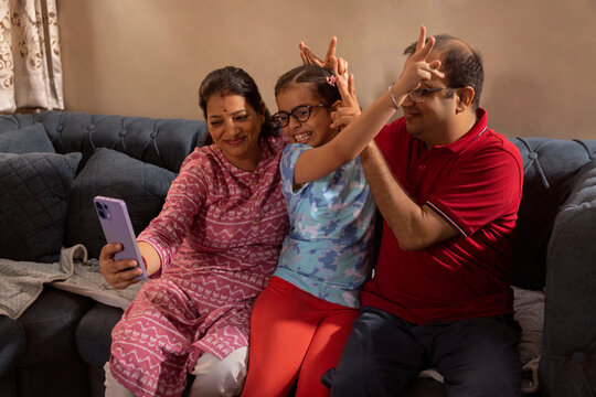 captured moment of father and daughter bonding by mother
