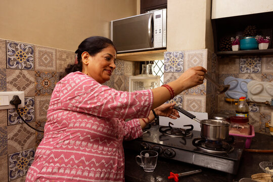  housewife preparing tea for herself