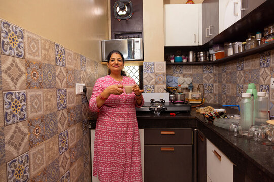 housewife enjoying her tea at kitchen