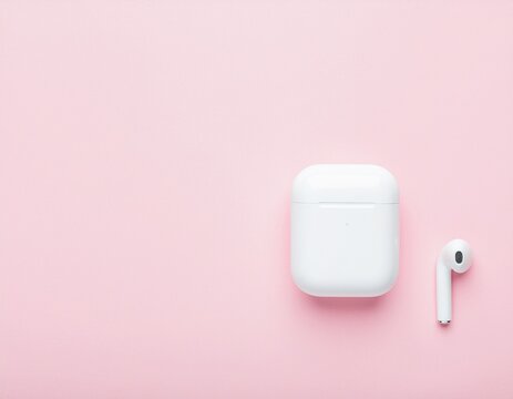 White True Wireless Earbuds Resting on Soft Pink Pastel Background Minimal Product Shot