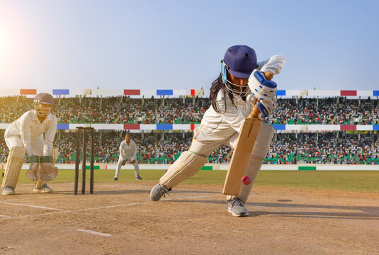 Cricketer playing a defensive shot in a match