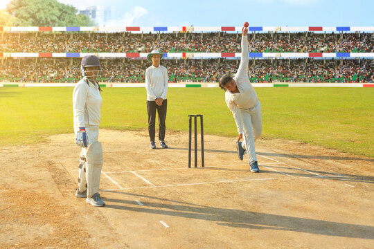 Bowler delivers a ball during a cricket match