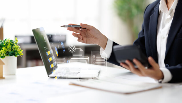 Business woman Documents, Business analysis summary graph reports of business operating expenses and work data about the company's financial statements.
