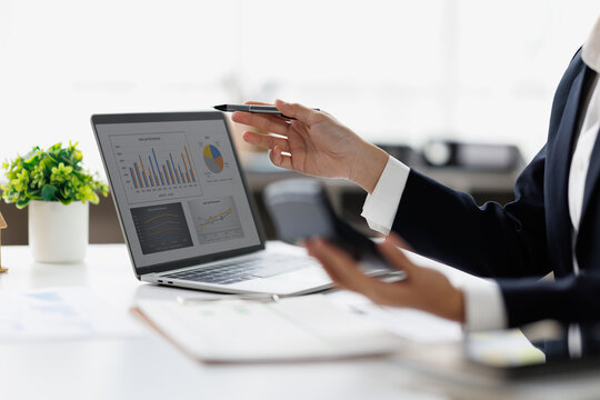 Hands and graphs on tablet screen for finance results, profit growth and budget review. Business woman financial report, revenue stats and dividend comparison of risk assessment
