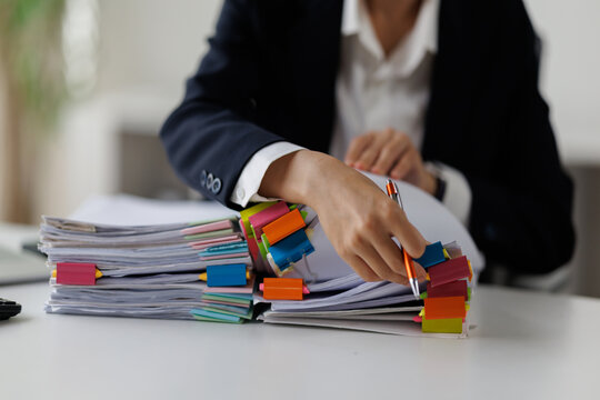 Serious professional businesswoman in office working with Documents, Business, accountant Documents documents at her desk in a modern office environment
