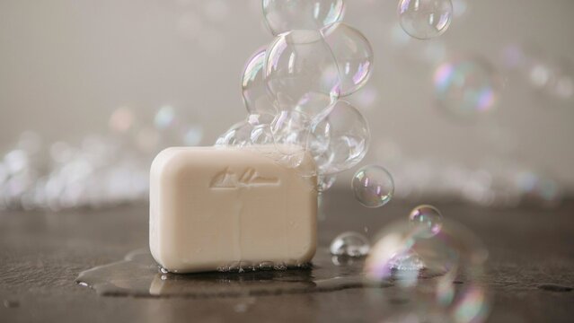 Soap bubble as background / A bar of soap, surfactant used in conjunction with water for washing and cleaning