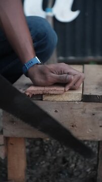 carpenter working on a wooden plank